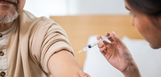 Man receiving a vaccine