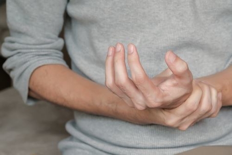 person holding their wrist