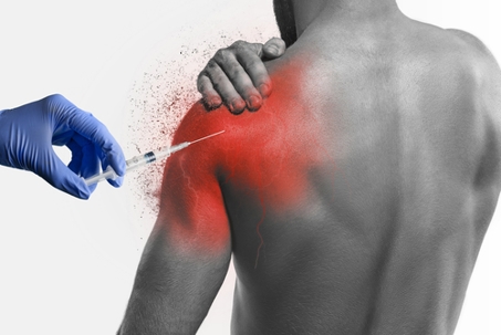 hand with blue glove giving needle injection into shoulder